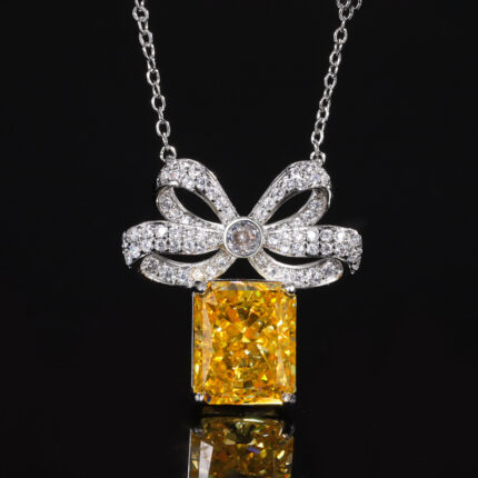 The color gemstone cutting technology is popular, with high carbon content, and the main component carbon element is the same as that of real diamonds. Highly simulated diamond Redion cut ice flower copper temperament light luxury bow pendant for women 10 * 12 wholesale